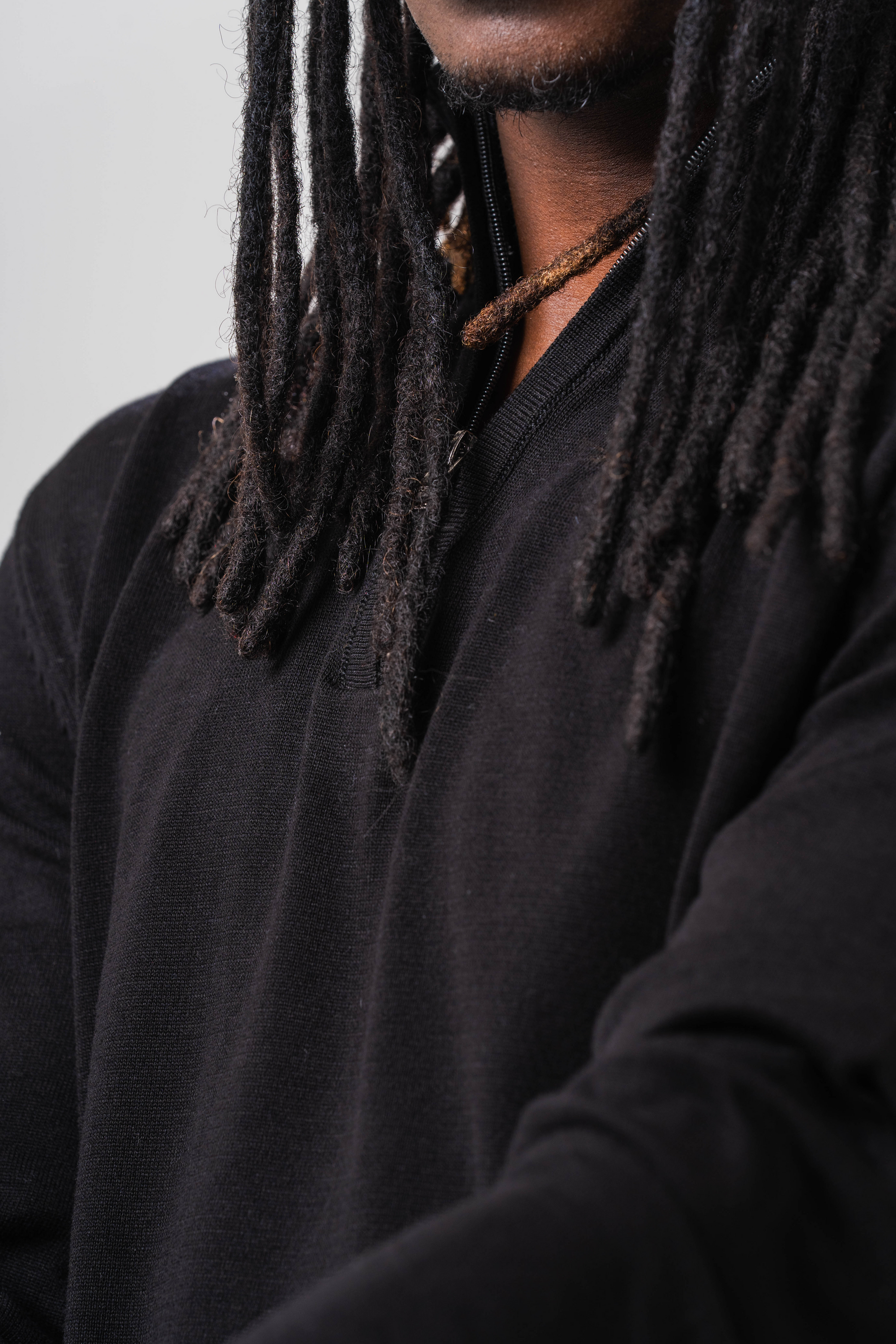 Close up view of Male model wearing the Sonder Black Quarter Zip